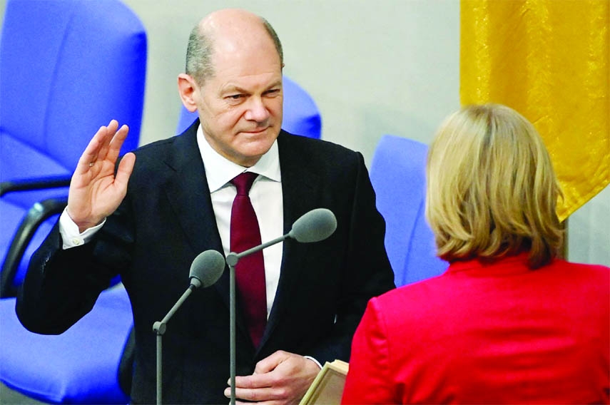 Newly elected German Chancellor Olaf Scholz is sworn in by parliament President Baerbel Bas in the German Parliament Bundestag in Berlin on Wednesday.