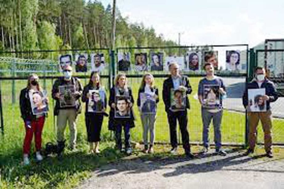 Press advocacy group Reporters Sans Frontieres activists and local journalists hold photos of journalists detained in Belarus at the Salcininkai border crossing point, Lithuania. Agency photo