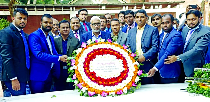 Md Masud Biswas, newly appointed head of Bangladesh Financial Intelligence Unit (BFIU), pays homage to the portrait of Bangabondhu Sheikh Mujibur Rahman with flowers at Tungipara in Gopalganj on Friday. Other senior officials of BFIU were present.