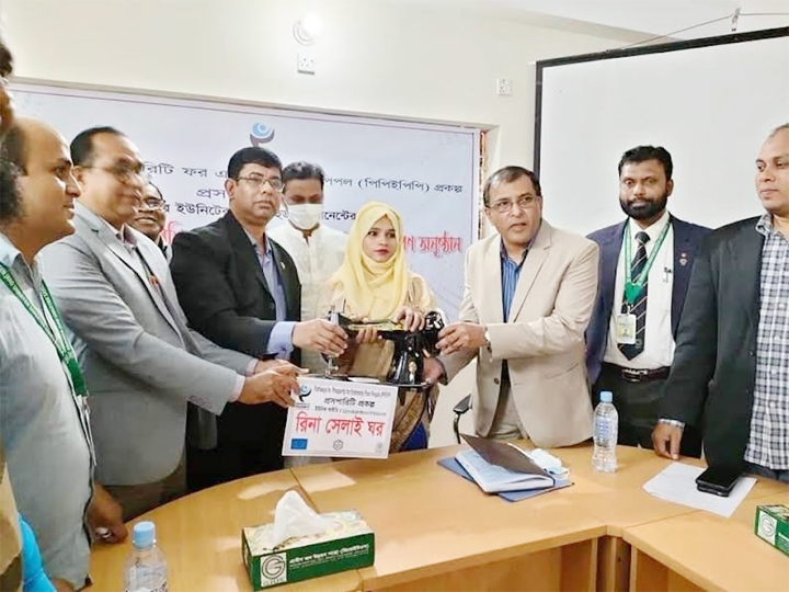 BHOLA: District Animal Resources Officer Dr Indrajit Kumar Mandal distributes sewing machines among the poor free of cost at a programme in Sadar upazila on Saturday.