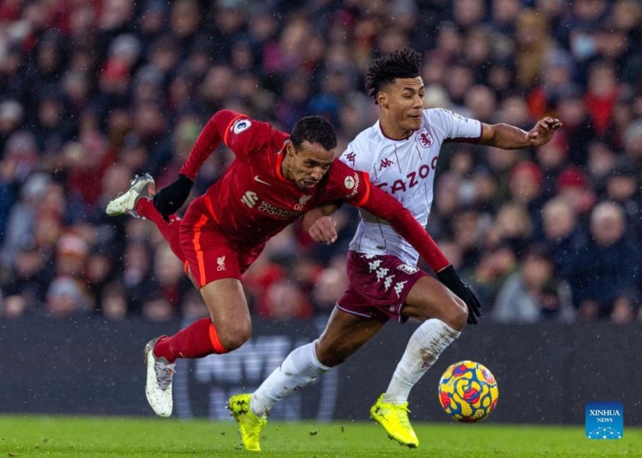 Liverpool's Joel Matip (left) challenges Aston Villa's Ollie Watkins during the English Premier League match between Liverpool and Aston Villa in Liverpool, Britain on Saturday. Agency photo