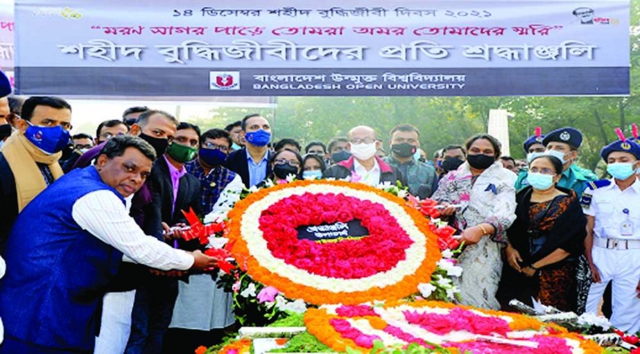 GAZIPUR : Prof Dr. Syed Humayun Akhter, VC, Bangladesh Open University (BOU) placing wreaths at the Martyr Memorial to mark the Martyred Intellectuals' Day on Tuesday . NN Photo