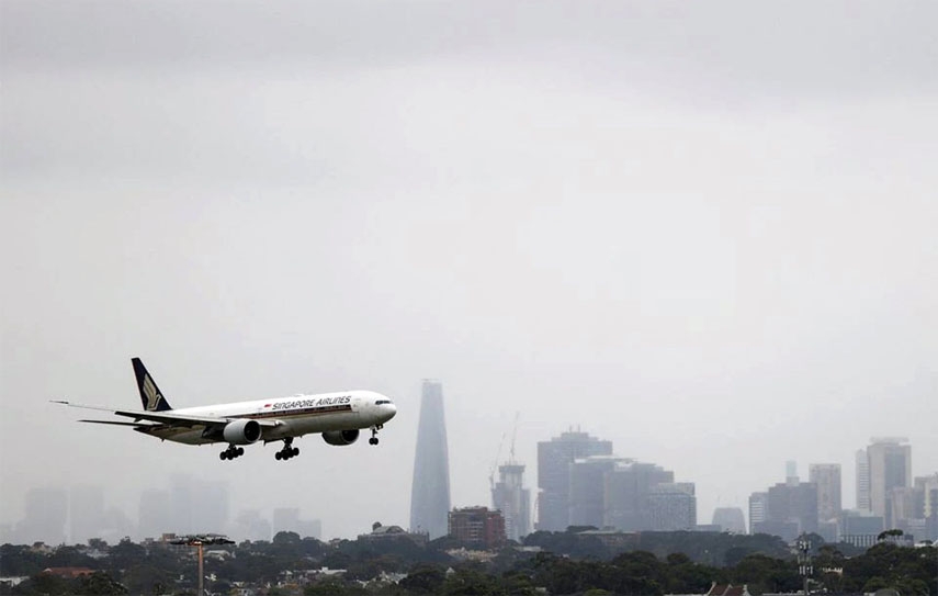 A Singapore Airlines plane arriving from Singapore lands at the international terminal at Sydney Airport, as countries react to the new coronavirus Omicron variant amid the Covid-19 pandemic, in Sydney, Australia.