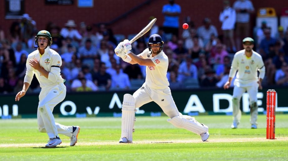 England batter Dawid Malan cuts a ball away as Australia's Marnus Labuschagne and Travis Head look on, on the third day of their second Ashes Test in Adelaide on Saturday. Agency photo