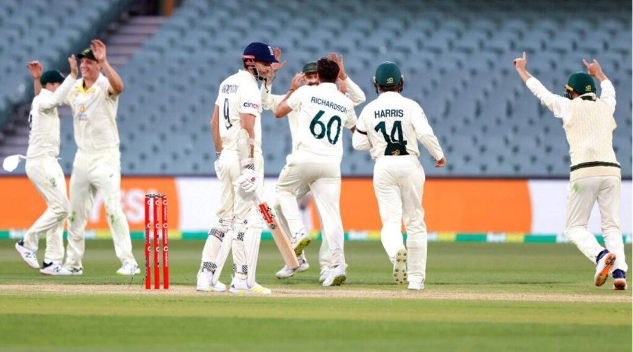 England's James Anderson (3rd from left) watches as Australia celebrate their victory on the fifth day of their Ashes cricket Test match in Adelaide, Australia on Monday. Australia win the match by 275 runs. AP photo