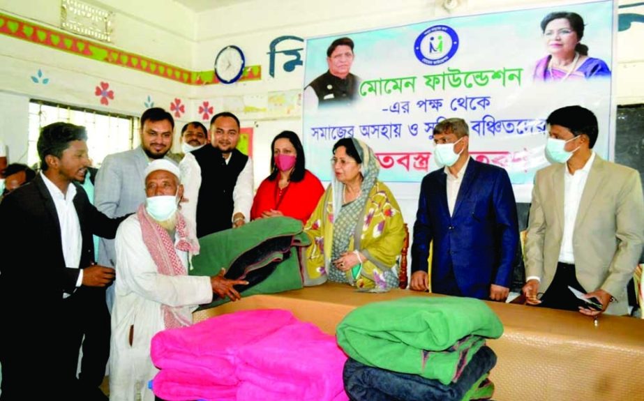 SYLHET: Momen Foundation distributes bblankets among the cold- hit people at Jalalalbad Union recently. NN photo