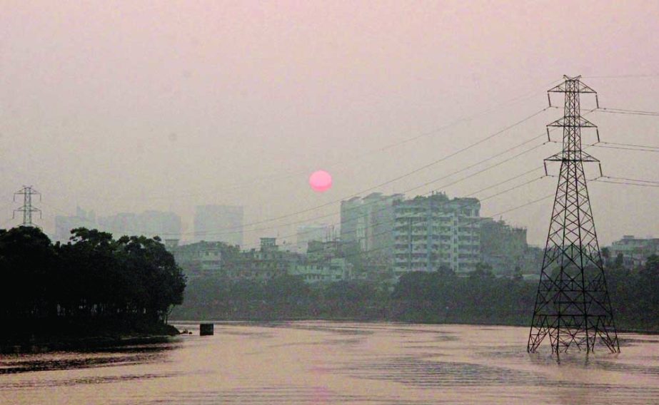 The sun rises on foggy Tuesday morning as mild to moderate cold wave swept across the country.NN photo