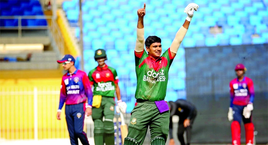 Mahfijul Islam celebrates after completing his century against Kuwait at Sharjah Cricket Stadium in Sharjah, UAE on Saturday.