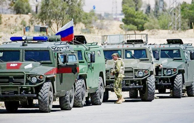 Russian troops near Ukraine border after month-long drills.