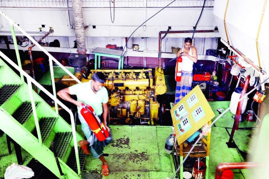 Workers install fire hydrants in a launch at Sadarghat Terminal on Sunday following the deadly fire incident in MV Avijan-10 in Jhalakathi. NN photo