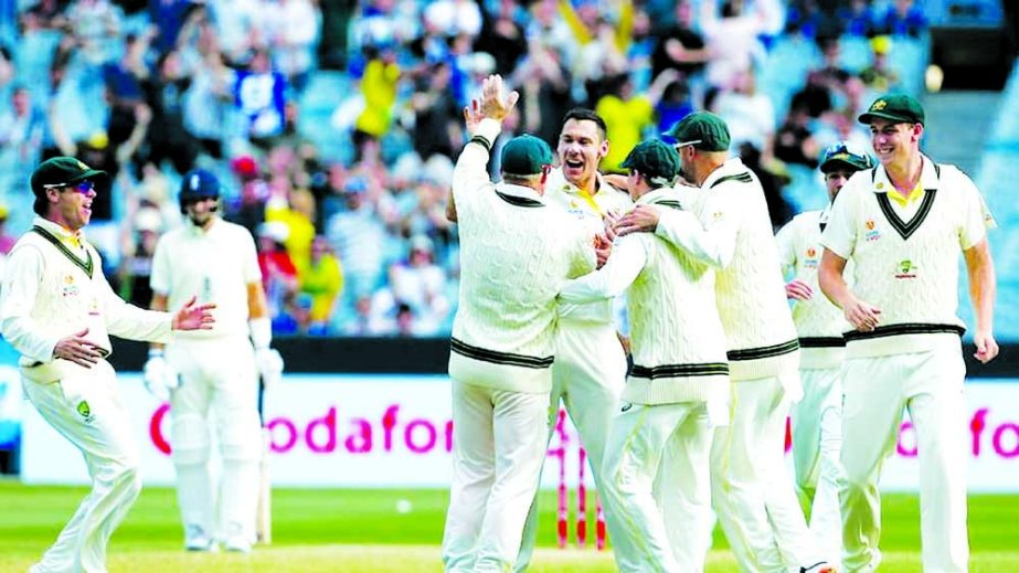 Australia's Scott Boland (center) celebrates the wicket of England's Haseeb Hameed (not pictured) with teammates on day two of the third Ashes cricket Test match between Australia and England in Melbourne on Monday. Agency photo