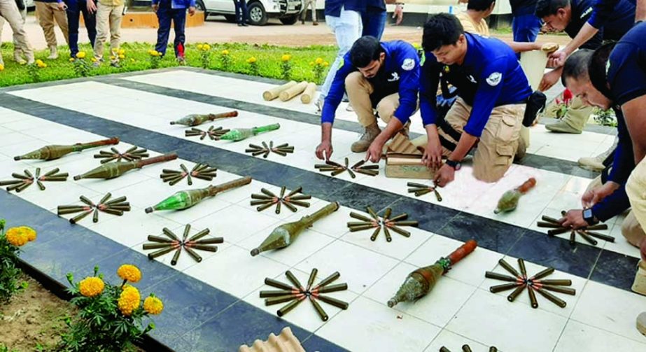 Police show the weapons and ammunition seized during the drive before the media at Chunarughat police station premises in Habiganj on Monday. NN photo