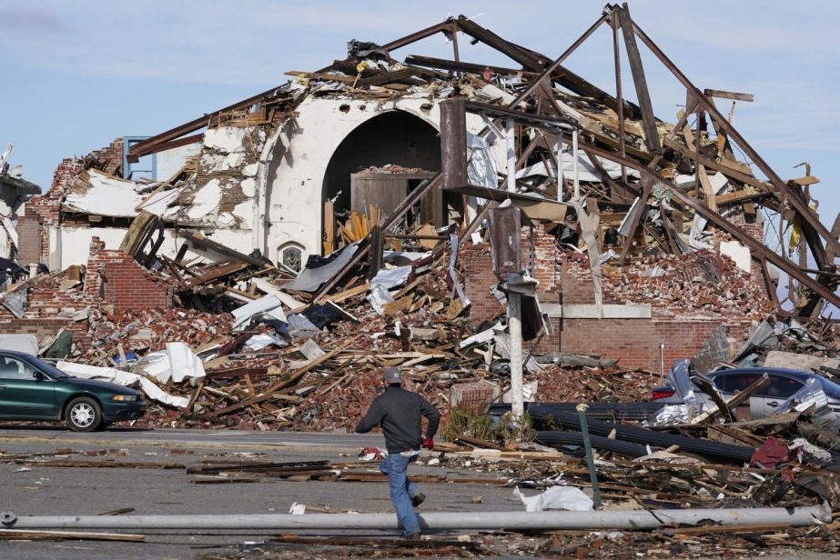 People survey damage from a tornado in Mayfield, Ky., on Dec. 11. Photo: LA Times