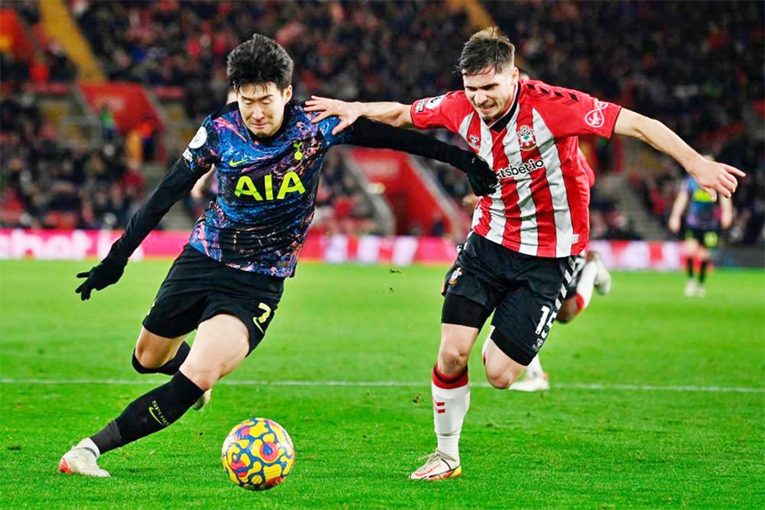 Tottenham Hotspur's striker Son Heung-Min (left) vies with Southampton's defender Romain Perraud during the English Premier League football match at St Mary's Stadium in Southampton, southern England on Tuesday.