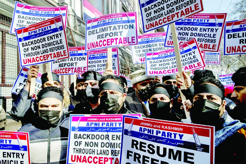 Activists of Jammu Kashmir Apni Party (JKAP) carry placards during a silent protest march in Srinagar, Indian controlled Kashmir on Wednesday.
