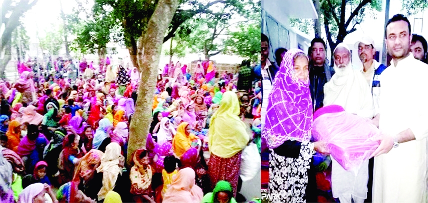 ISHWARDI (Pabna) : Awami League Information and Research Sub-Committee member Sakibur Rahman Sharif distributes blankets and winter clothes among destitute in Ishwardi on Thursday.