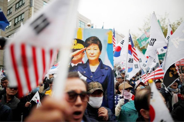 Former South Korean President Park Geun-hye marching through the town after release on Friday.