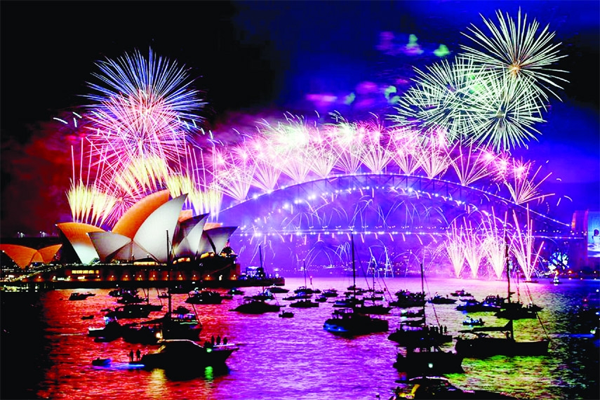 Fireworks explode over Sydney Harbour during New Year's Eve celebrations in Sydney, Australia on Friday.