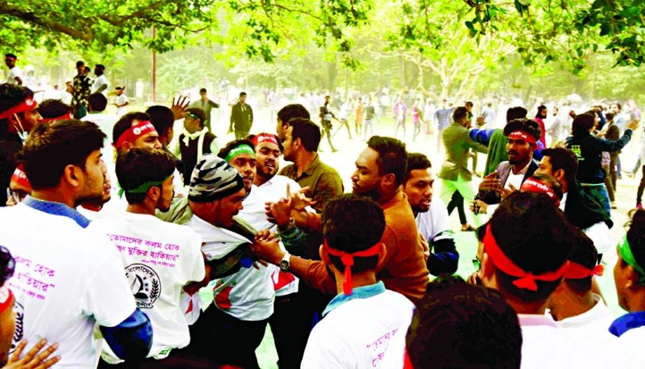 BCL activists locked in clashes during their 74th founding anniversary beside Dhaka University's Oporajeyo Bangla sculpture on Tuesday. NN photo