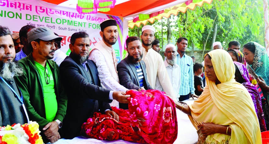 SYLHET: Alhaj Abdul Aziz., Founder of Hazrat Ali (R) Academy and Complex distributes blankets among the cold- hits at Dakshin Surma Upazila organised by Tetli Union Development Forum, a social organization recently.