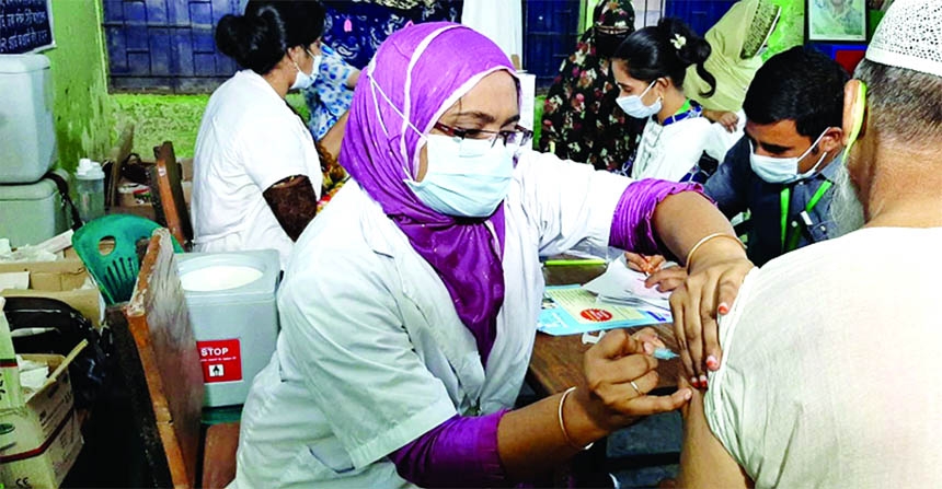 A nurse injects Covid-19 vaccine to an elderly man at a vaccination centre in the capital on Thursday.