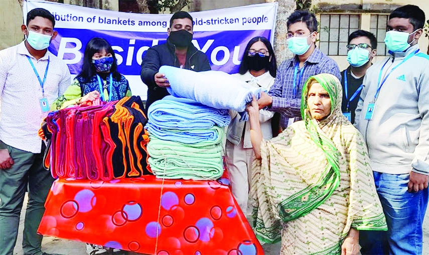 GANGACHARA (Rangpur): The distressed people receive blankets in Kutipara at Gagachara Upazila organised by Beside You, a voluntary organisation on Friday. Nayan Kumar Saha, Assistant Commissioner(land0)inaugurated the programme.