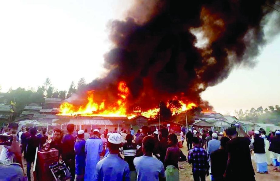 A massive fire rages through a Rohingya refugee camp at Ukhiya in Cox's Bazar on Sunday evening leaving more than 5,000 people homeless NN photo