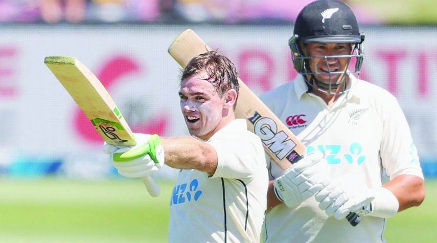 Tom Latham (left) of New Zealand celebrates his 200 runs on day two of the second cricket Test between Bangladesh and New Zealand at Christchurch in New Zealand on Monday.