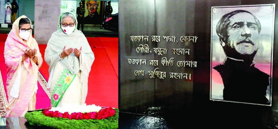 Prime Minister Sheikh Hasina and her sister Sheikh Rehana offer Munajat after paying floral tributes at the portrait of Father of the Nation Bangabandhu Sheikh Mujibur Rahman marking Homecoming Day of Bangabandhu. PID photo