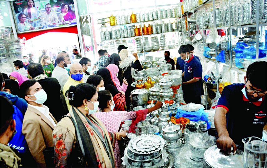 Visitors crowd at a stall in the International Trade Fair on Friday, the weekly holiday.