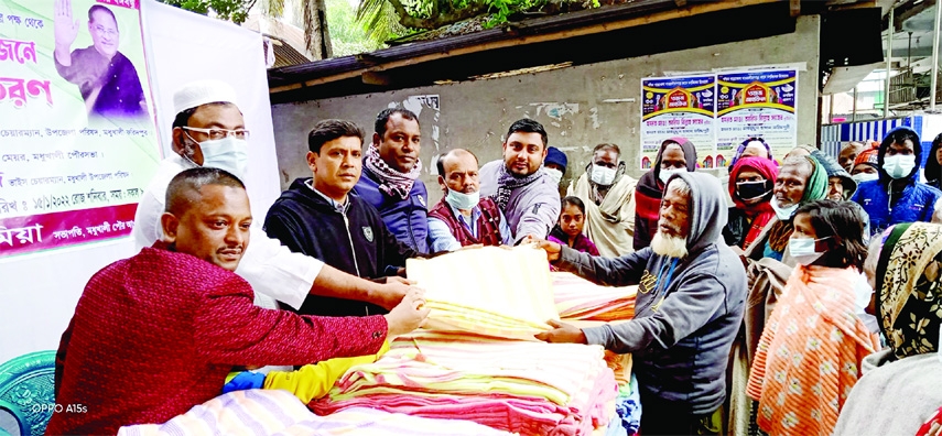 MADHUKHALI (Faridpur): Haji Mohammad Ali Mia, President, Madhukhali Poura Awami League distributes blankets among the poor people at Madhukhali Upazila organised by Rasel Bread and Biskut Factory on behalf of former MP Abdul Rahman on Saturday.