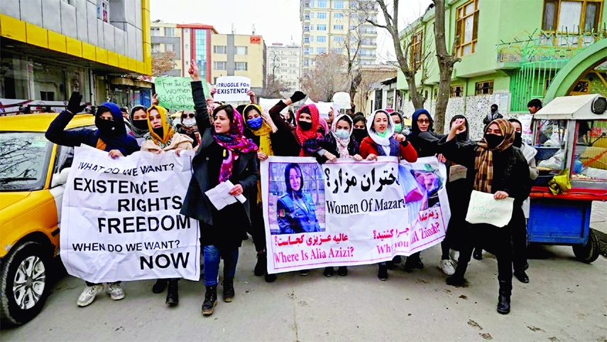 Afghan women march as they chant slogans and hold banners during a women's rights protest in Kabul on Sunday.