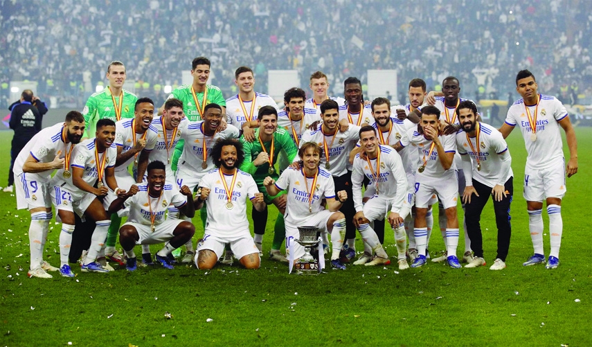 Real Madrid players celebrate after winning the Spanish Super Cup final football against Athletic Club Bilbao at the King Fahd International stadium in the Saudi capital of Riyadh on Sunday.