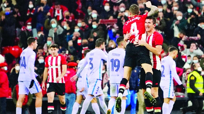 Athletic Bilbao's Inigo Martinez celebrates with teammates after winning the match against Barcelona in their Copa del Rey match on Thursday.