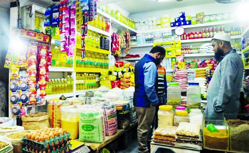 A man is seen visiting a grocery shop in the capital on Friday for buying essential commodities.