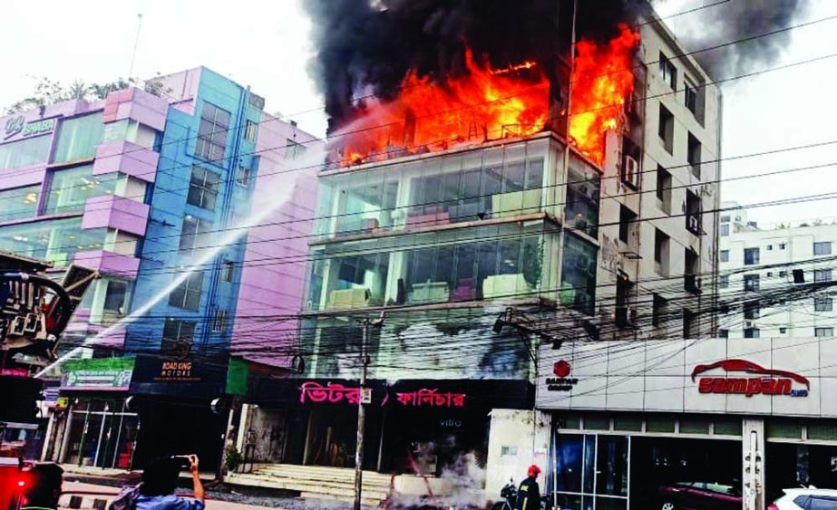 A fire breaks out at a furniture store next to the Bhatara Police Station in the capital's Baridhara area on Sunday afternoon. NN photo