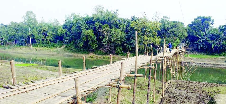 KURIGRAM: An iron bridge needed immediate over Baromasia River at Naodanga Union of Phulbari Upazila in Kurigram as the bamboo bridge is risky and in deplorable condition. This snap was taken on Monday.