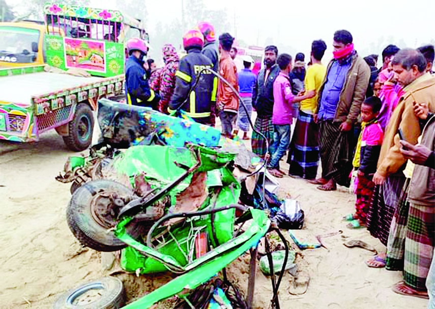 Outlookers witness a mangled CNG-run autorickshaw that rammed by a bus at Mirzapur area under Sherpur upazila in Bogura district on Wednesday leaving 5 people dead.