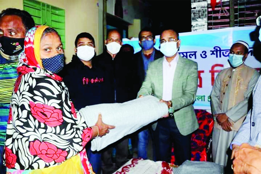 KISHOREGANJ: Mohammad Shamim Alam, DC, Kishoreganj distributes blankets among the 100 cold-hits people in Kishoreganj Town on Monday. Among others, ADC (Education, ICT) Golam Mostafa, ADC(Revenue)Md. Nuruzzaman and others officials were also present .