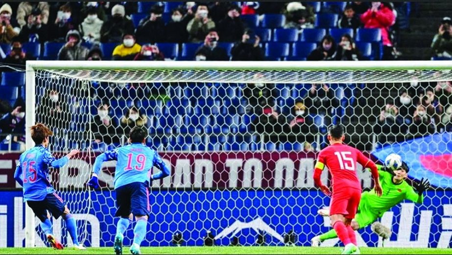 Japan's Yuya Osako (left) scoring a goal against China in their FIFA World Cup qualifier match on Thursday. =Agency photo