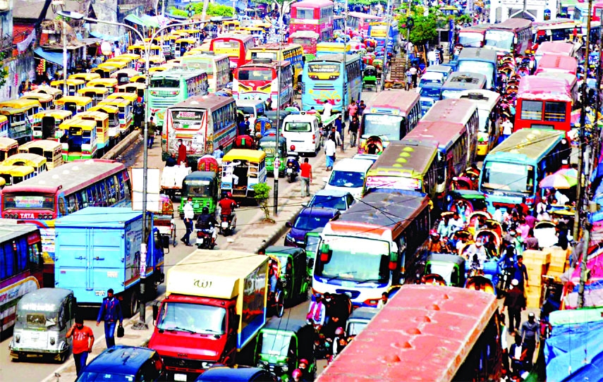 Hundreds of vehicles get stuck in tailback at the capital's busy area Gulistan on Thursday due to illegal parking and occupying of roads.