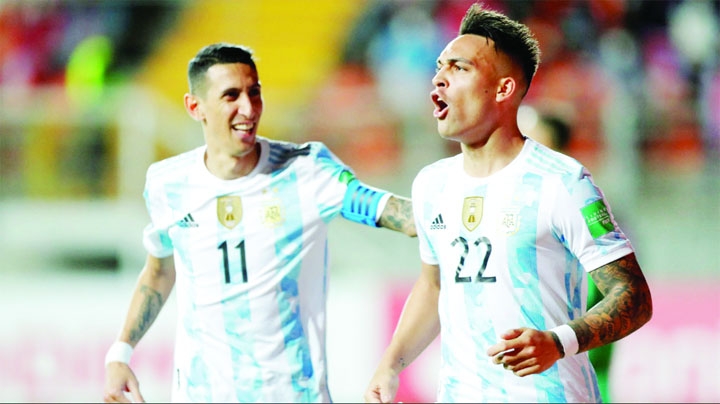 Argentina's Lautaro Martinez (right) celebrates scoring their second goal with teammate Angel Di Maria against Chile in their FIFA World Cup qualification match on Thursday.