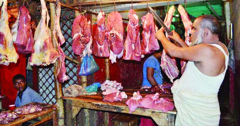 A trader is arranging meat at a shop at New Market in the capital on Saturday. NN photo