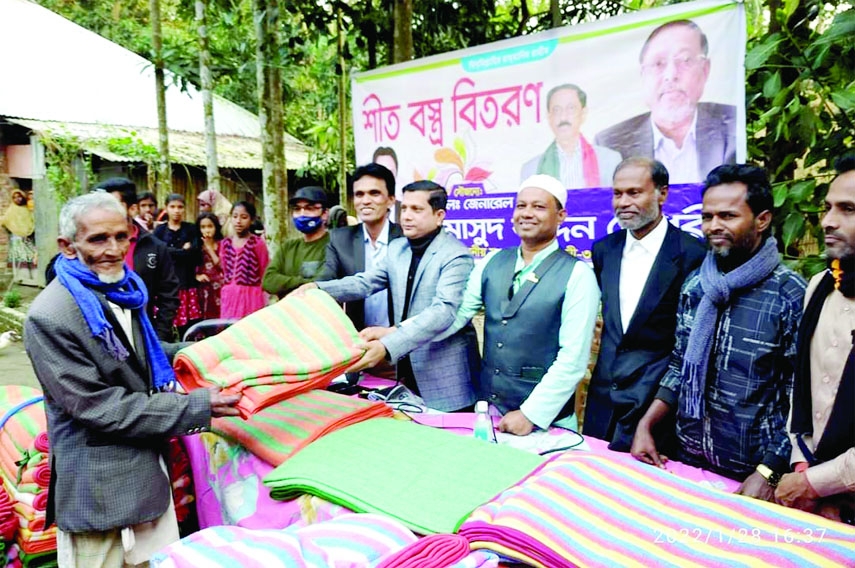 FENI: Azizul Huq Hiron, Newly-elected Chairman, Amirabad Union Parishad distributes blankets among the poor people at Sonagazi Upazila financed by Lt General (Retd) Masud Uddin Chowdhury on Friday.