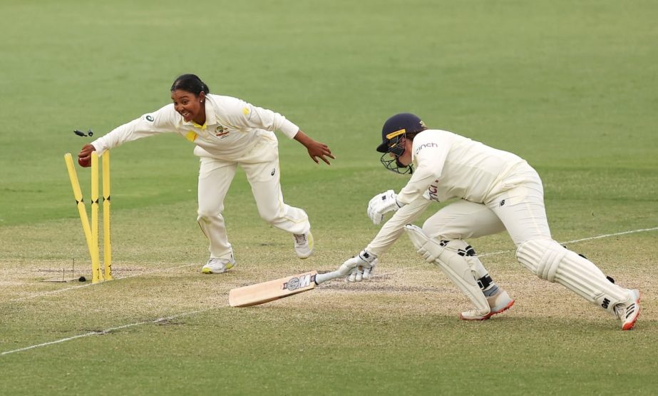 Alana King (left) runs out Anya Shrubsole on day four of the Women's Ashes Test between Australia and England at Manuka Oval in Canberra on Sunday. Agency photo