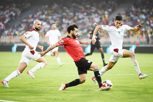 Egypt's forward Mohamed Salah (center) in action against Morocco during the Africa Cup of Nations 2021 quarter-final football match at Stade Ahmadou Ahidjo in Yaounde on Sunday.