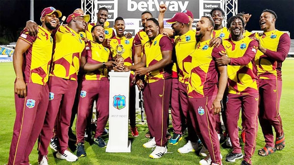 West Indies's players pose with the winning trophy at the end of the 5th and final T20I between West Indies and England at Kensington Oval, Bridgetown, Barbados on Sunday.
