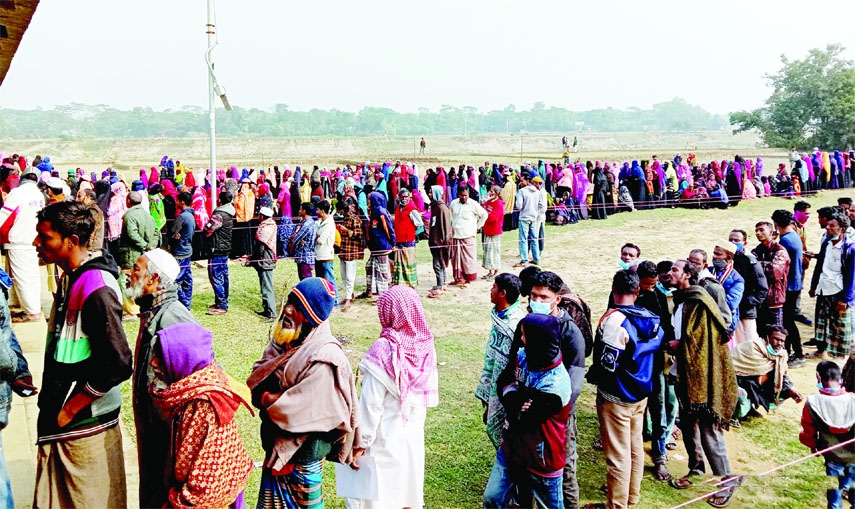 Voters stand in long queues to cast votes at Union Parishads (UP) polls in Sylhet on Monday as the sixth phase of the local government election ended in 218 unions across the country.
