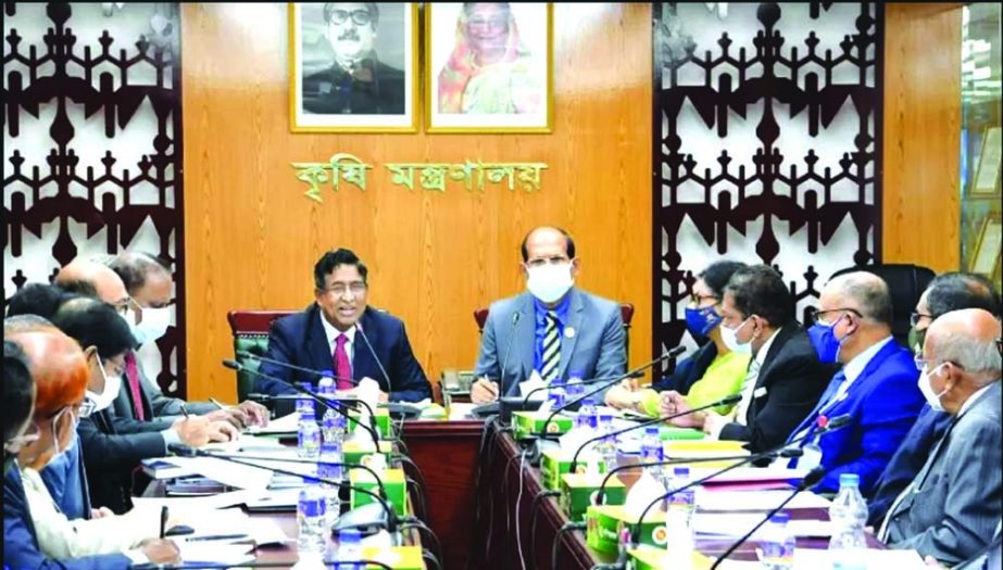 Agriculture Minister Dr M Abdur Razzaque exchanging views with the journalists following a meeting on raising rice production by cultivating hi-yielding inbreed and super hybrid at ministry's conference on Thursday.