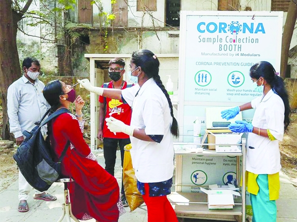 Sample being collected from a girl for corona test .